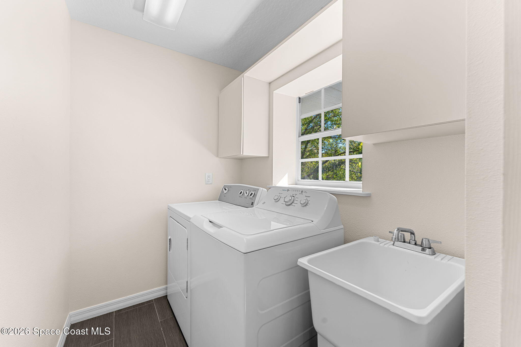 1325 Chase Hammock Road Merritt Island, FL 32953 - Photo 41 of 83 a utility room with dryer and washer