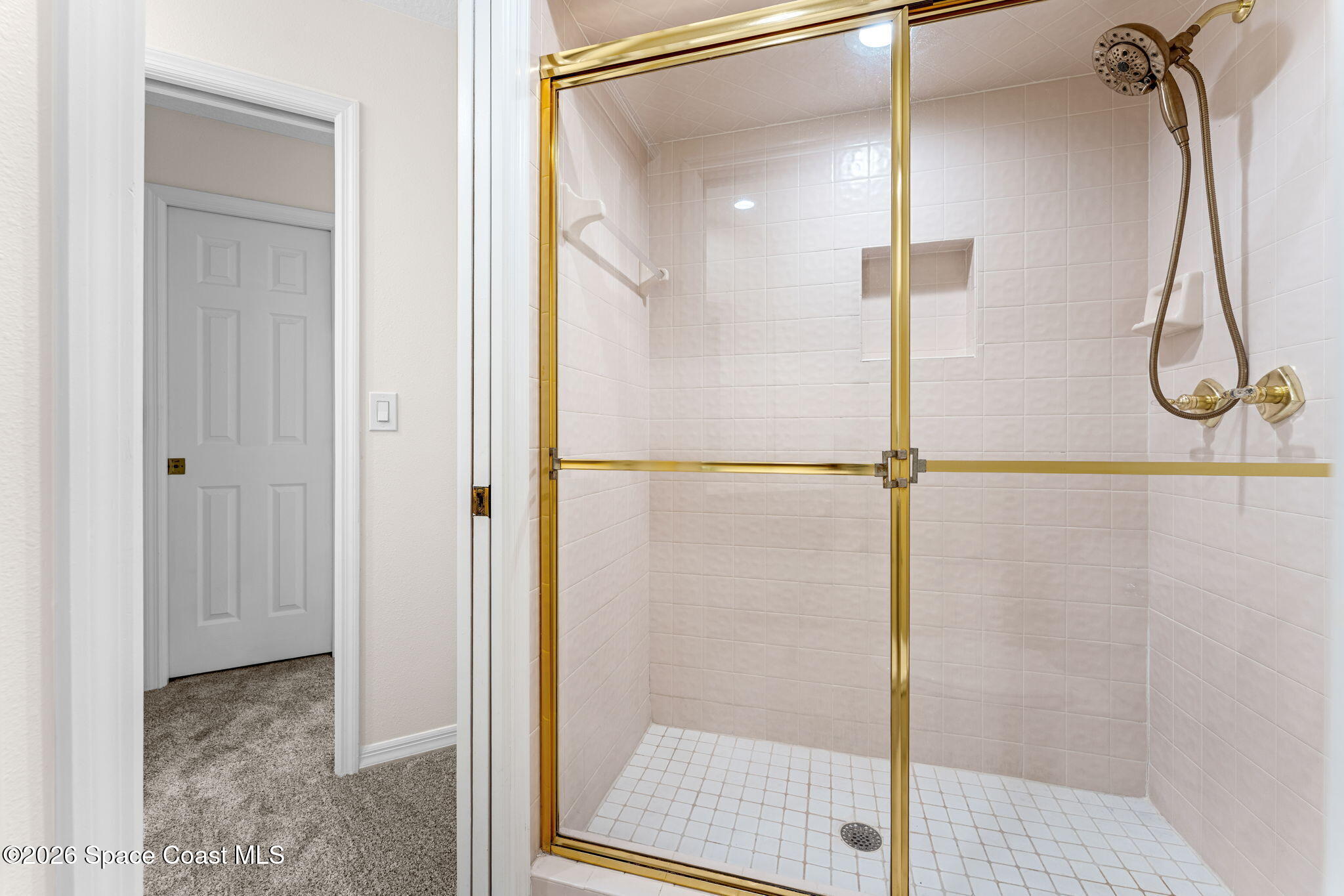 1325 Chase Hammock Road Merritt Island, FL 32953 - Photo 45 of 83 a bathroom with a glass shower door