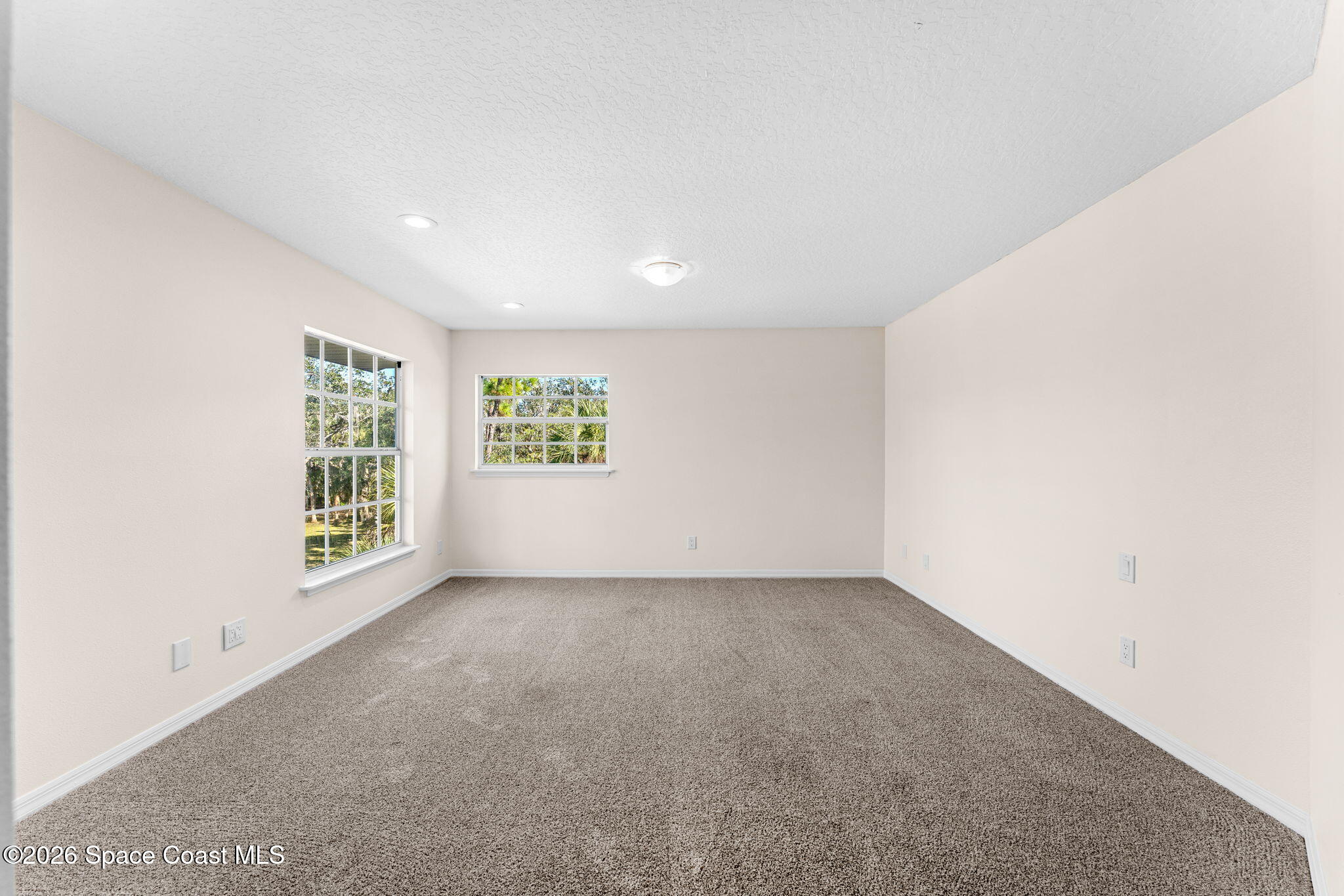 1325 Chase Hammock Road Merritt Island, FL 32953 - Photo 50 of 83 an empty room with windows