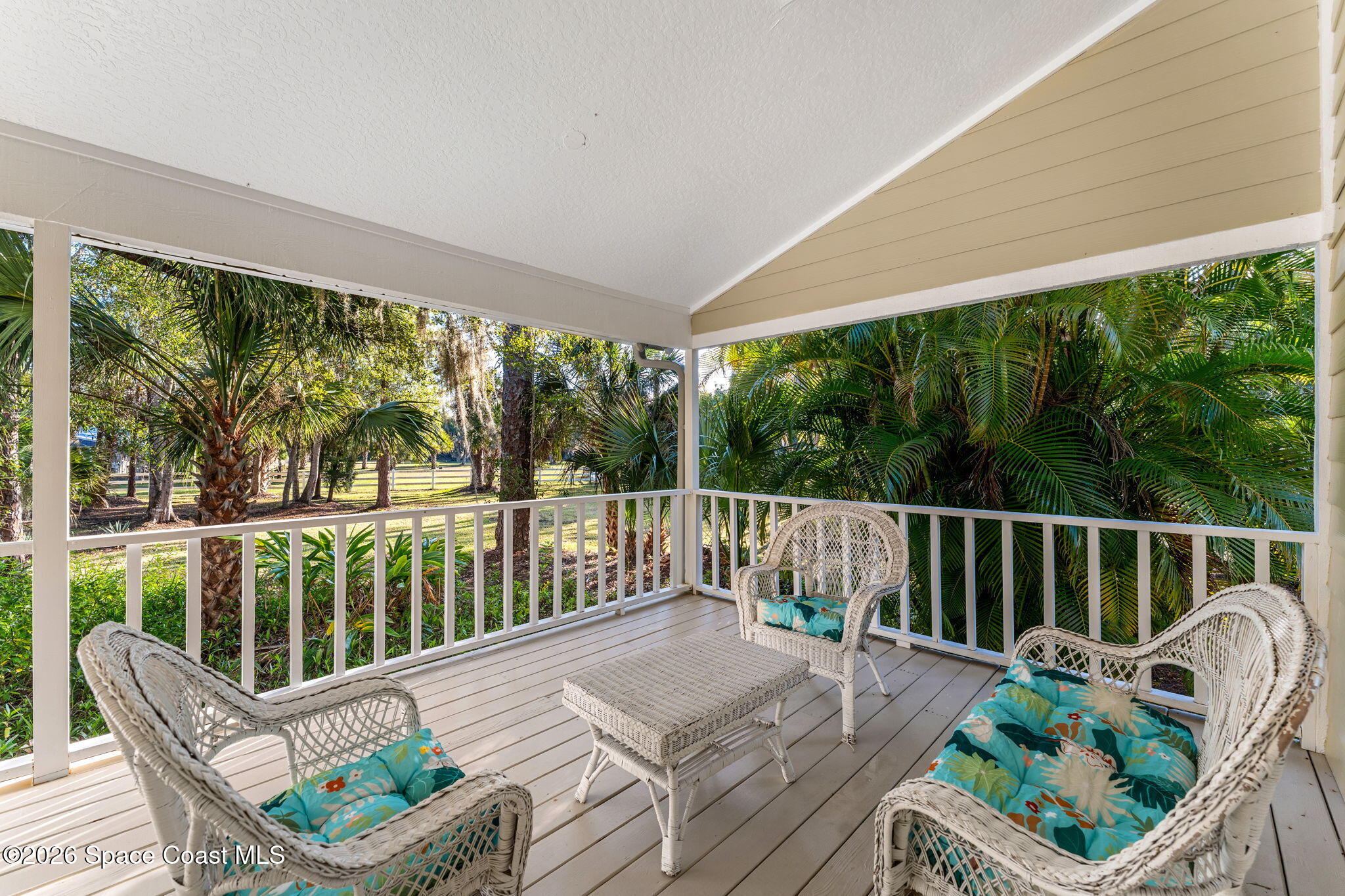 1325 Chase Hammock Road Merritt Island, FL 32953 - Photo 58 of 83 a balcony with wooden floor outdoor seating and nature