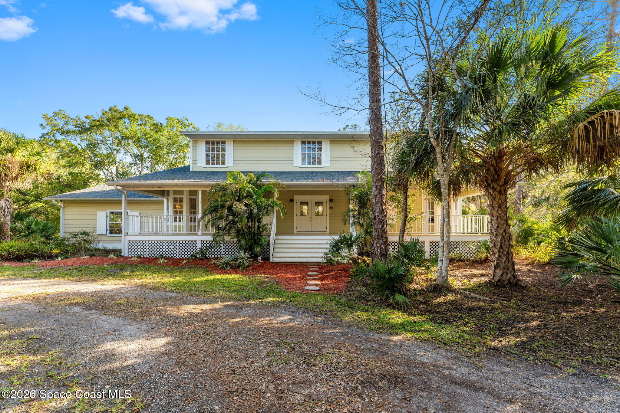1325 Chase Hammock Road Merritt Island, FL 32953 - Photo 6 of 83 front view of a house with a yard