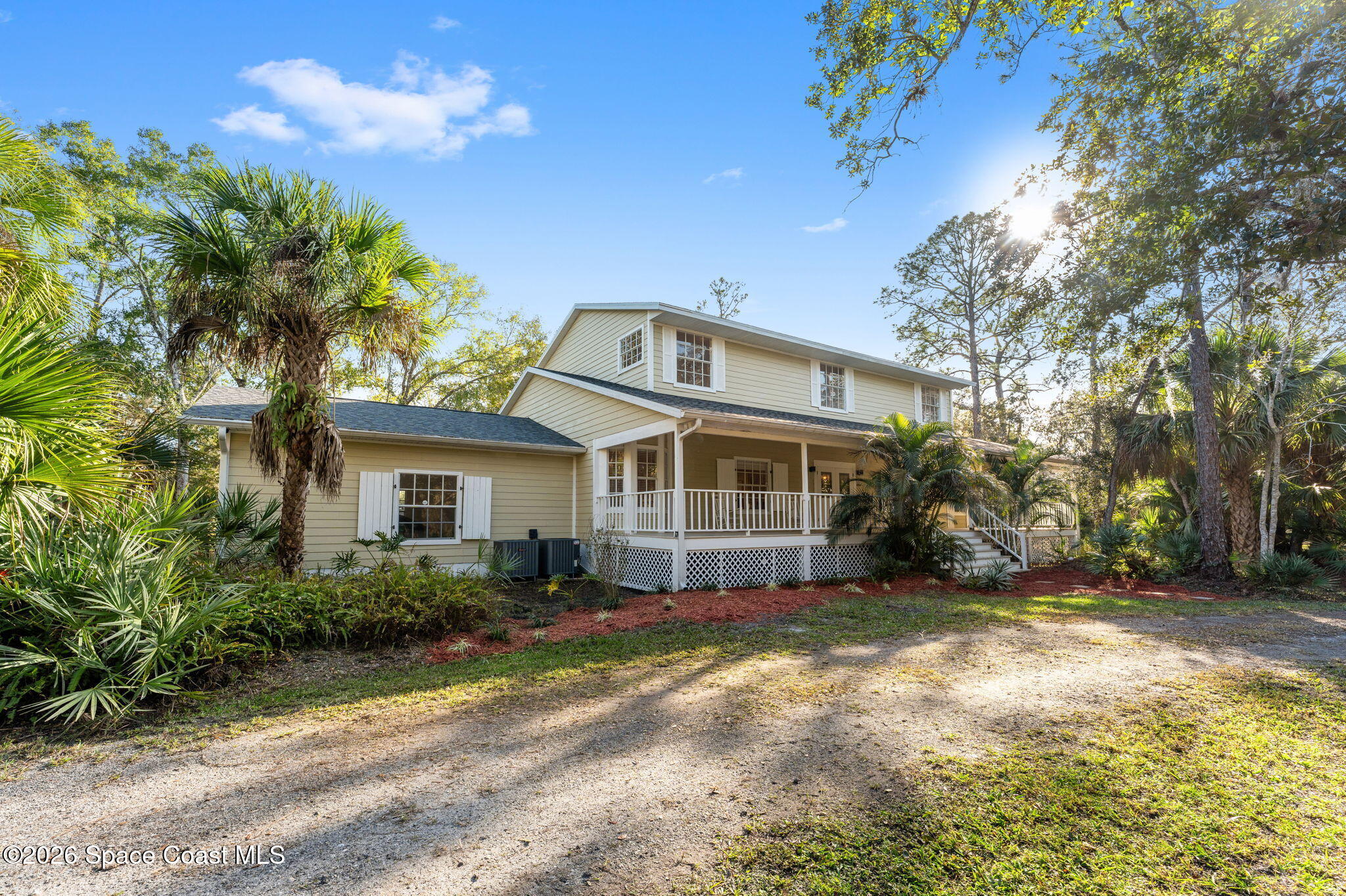 1325 Chase Hammock Road Merritt Island, FL 32953 - Photo 7 of 83 a front view of a house with a yard