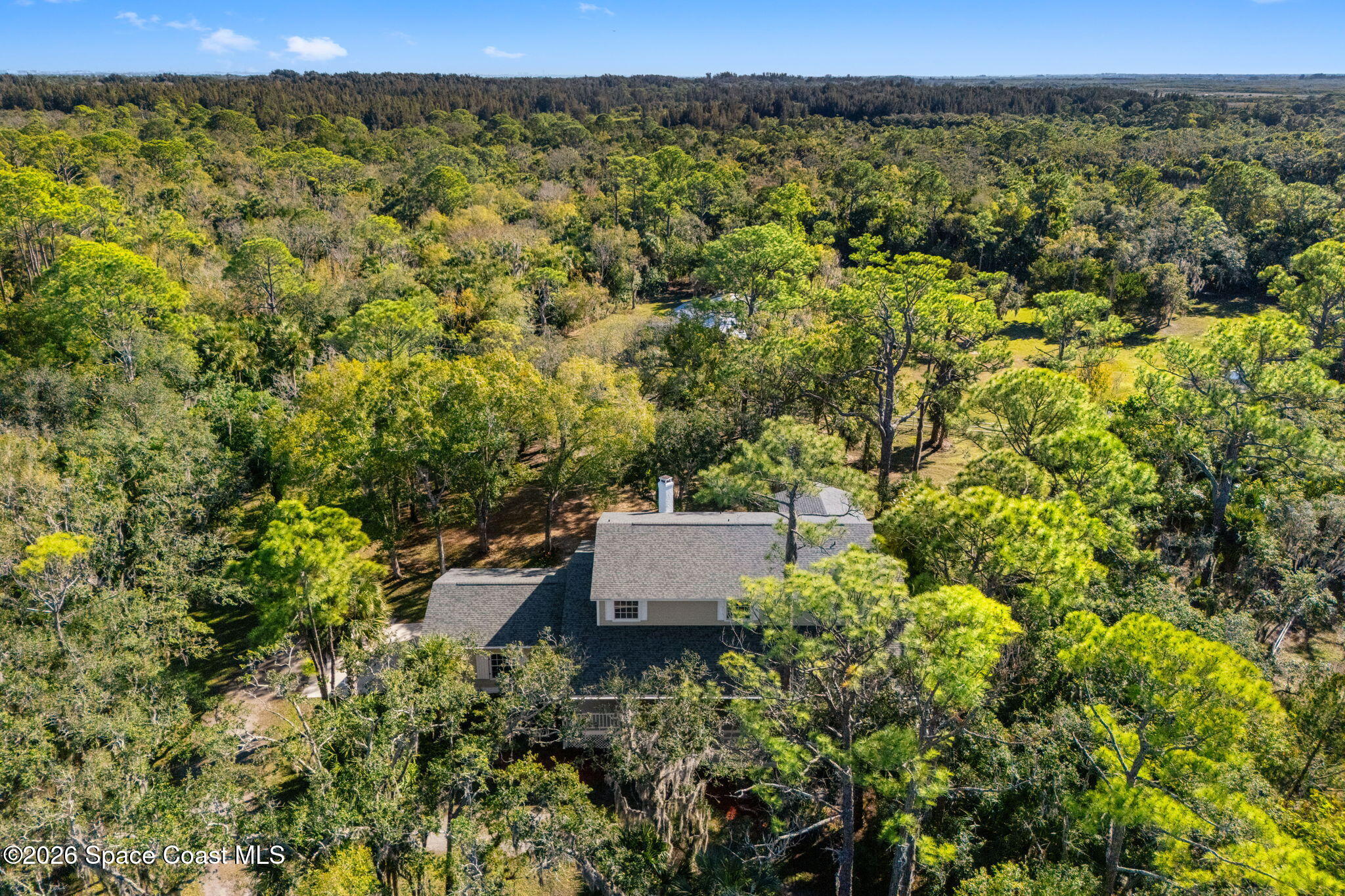 1325 Chase Hammock Road Merritt Island, FL 32953 - Photo 77 of 83 an aerial view of a house with a yard