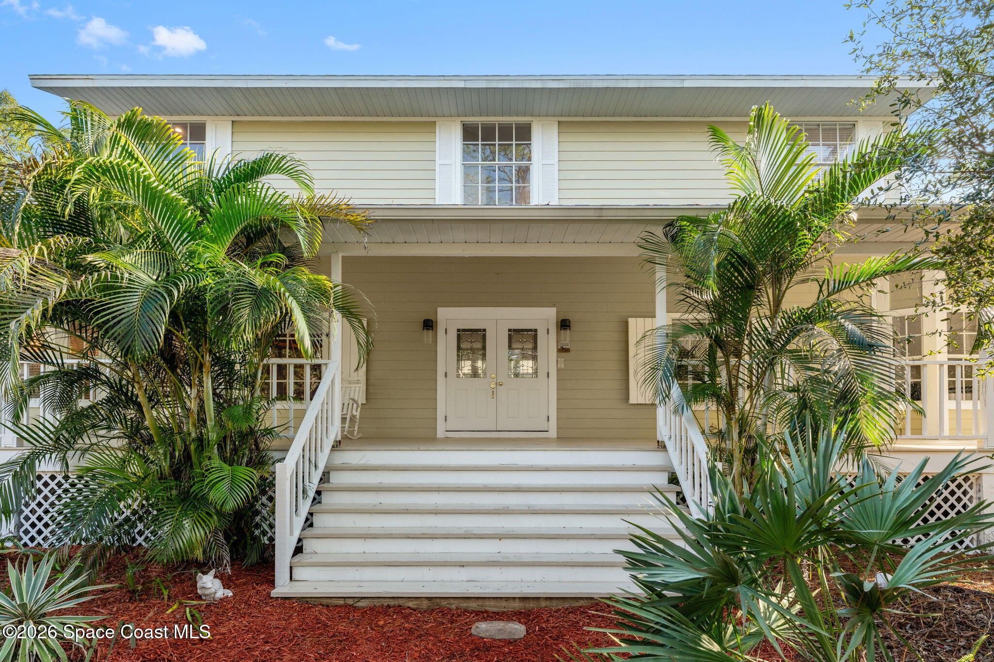 1325 Chase Hammock Road Merritt Island, FL 32953 - Photo 8 of 83 a front view of a house with a garden