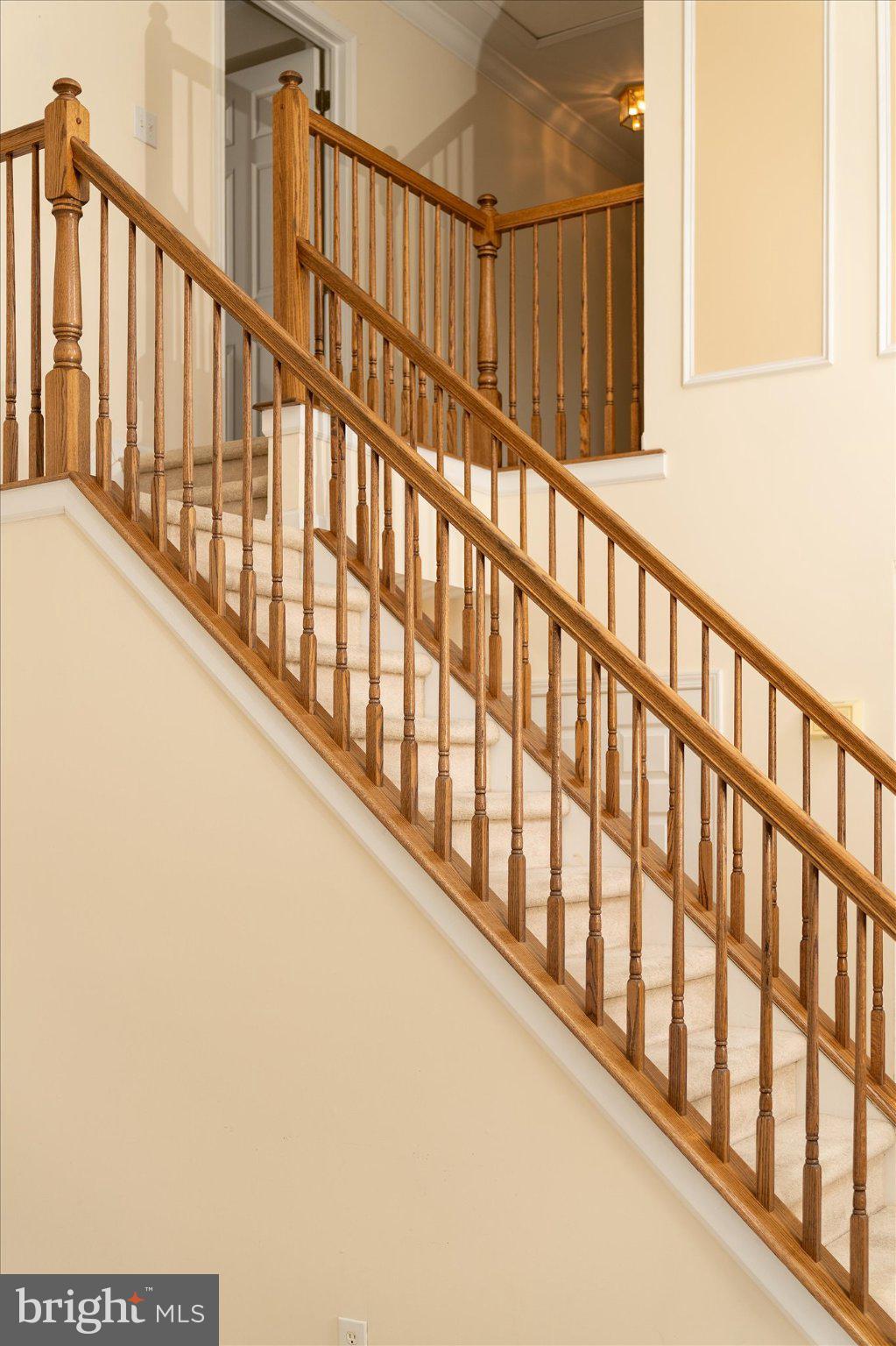 132 Coburn Road Pennington, NJ 08534 - Photo 5 of 50 Elegant staircase with wooden railings.