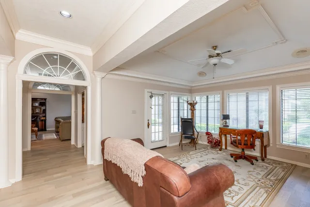 a living room with furniture and a large window