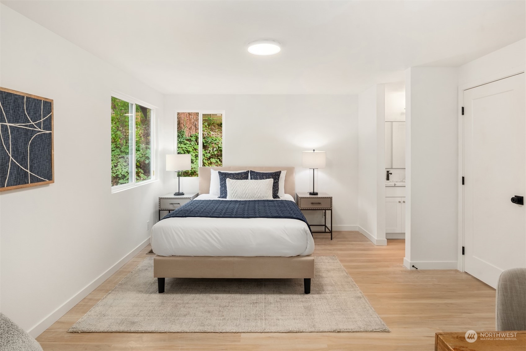 2375 Northeast 90th Street Seattle, WA 98115 - Photo 13 of 27 a bedroom with a bed and wooden floor