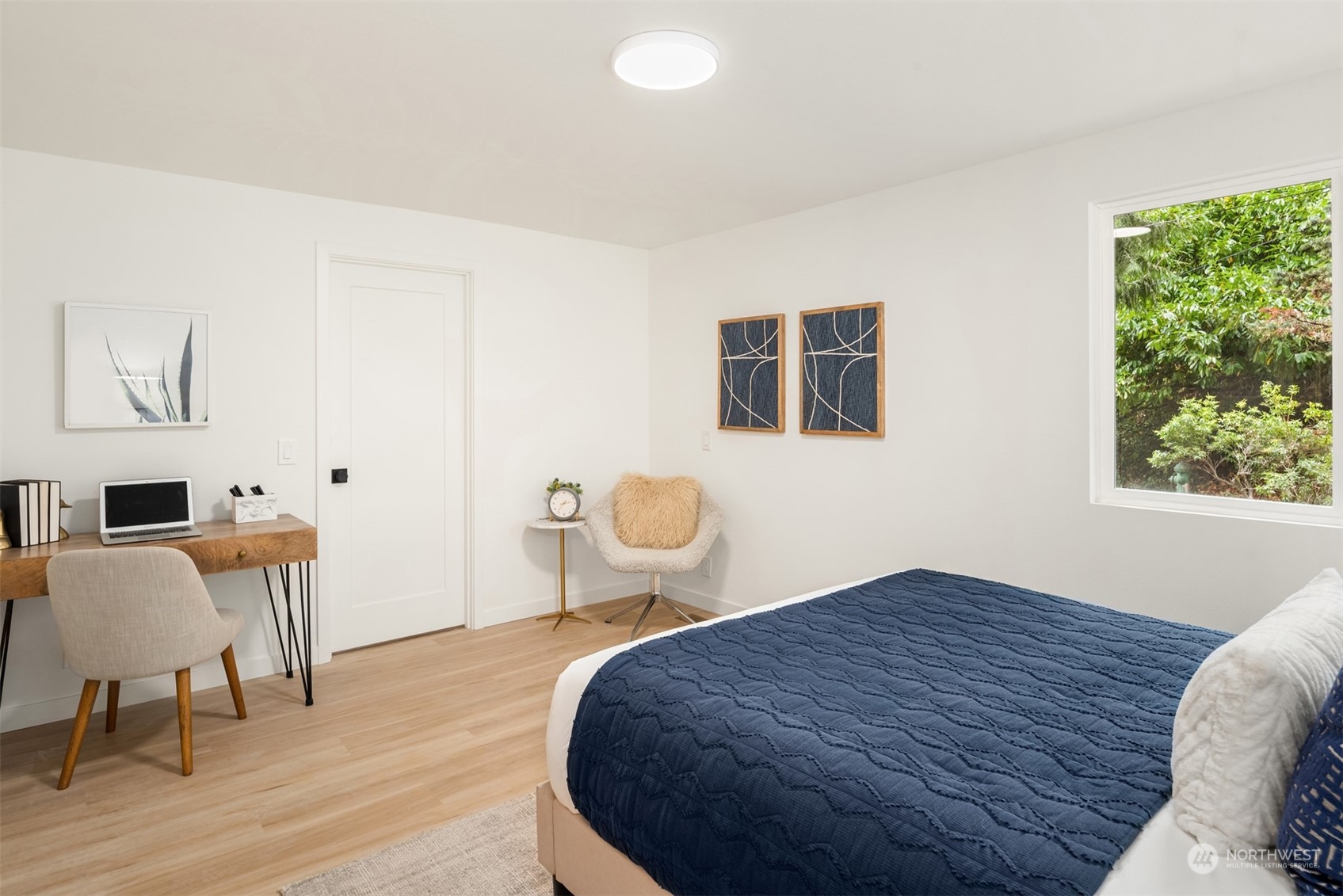2375 Northeast 90th Street Seattle, WA 98115 - Photo 15 of 27 a bedroom with a bed and a chair