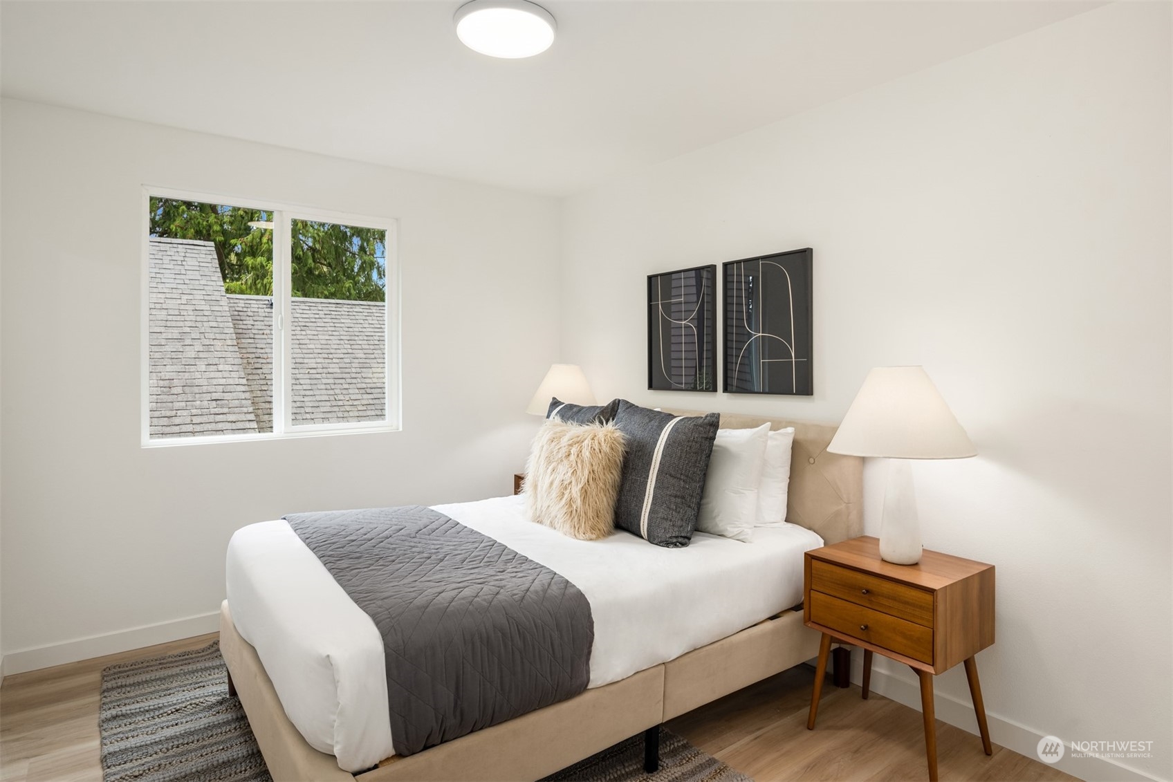 2375 Northeast 90th Street Seattle, WA 98115 - Photo 16 of 27 a bedroom with a bed and a window