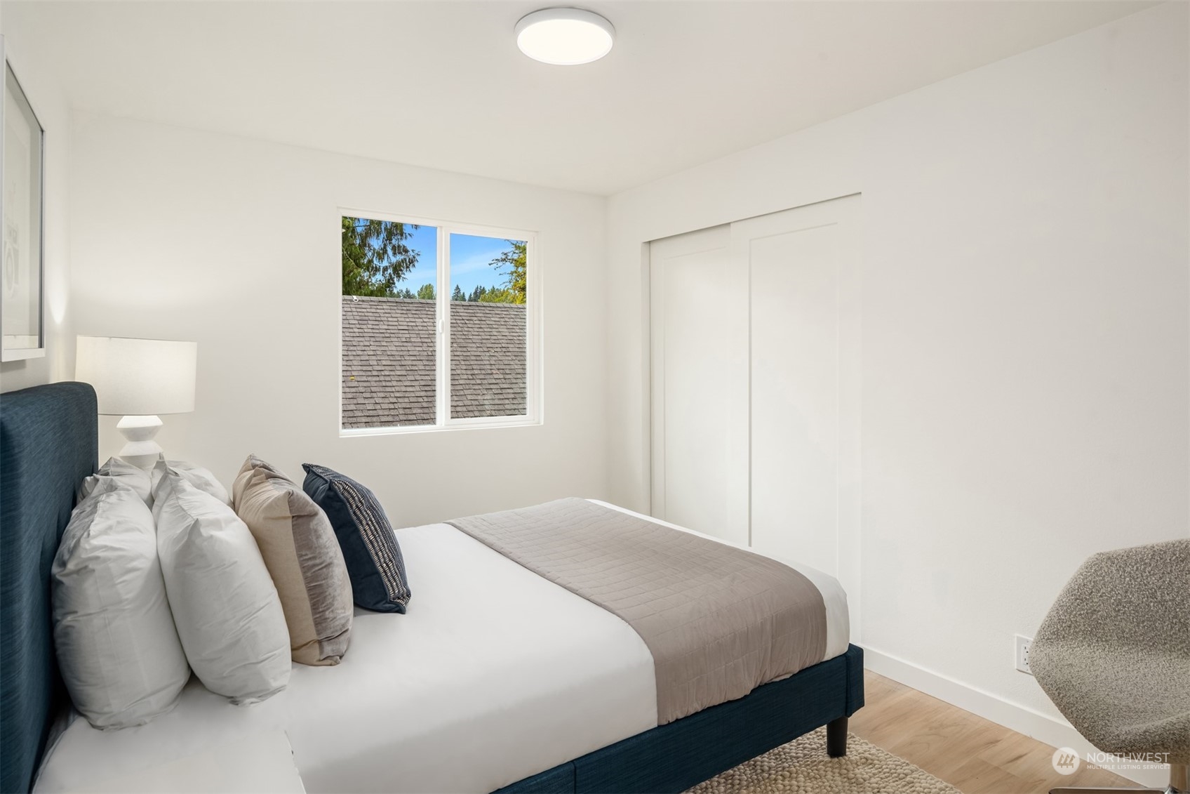 2375 Northeast 90th Street Seattle, WA 98115 - Photo 17 of 27 a bedroom with a bed and a window