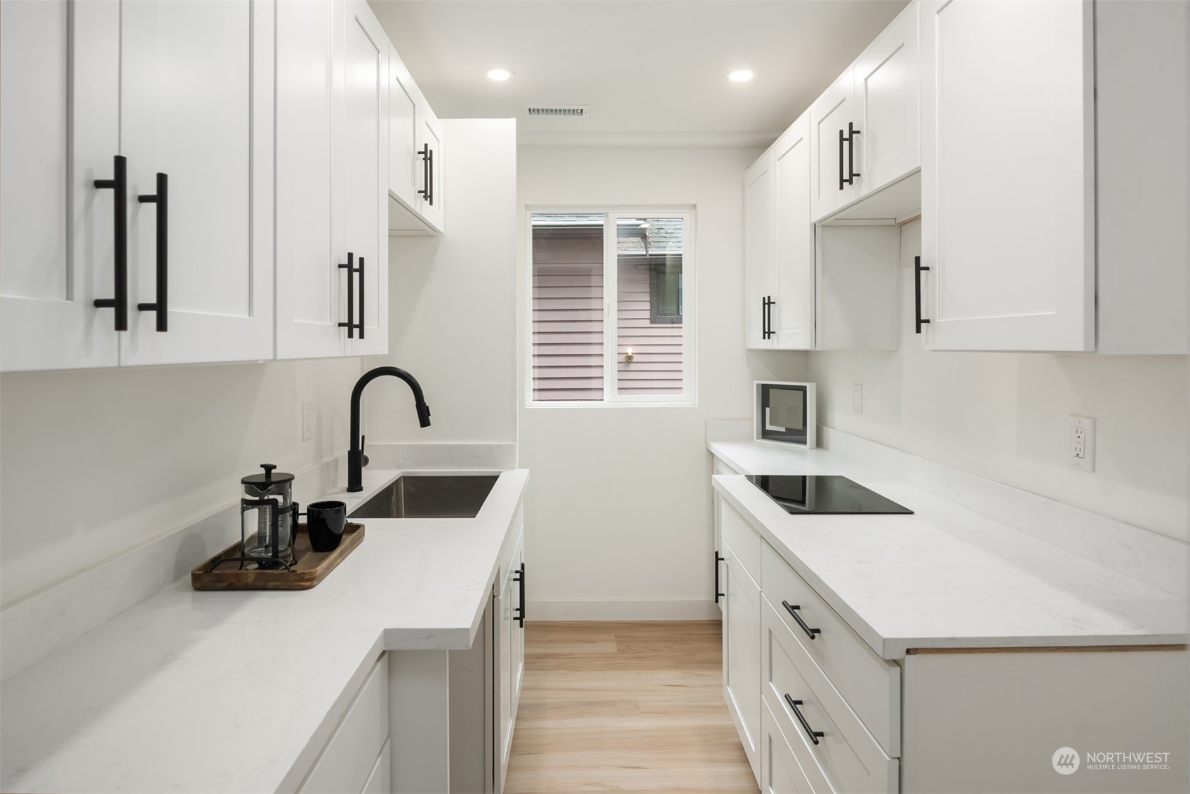 2375 Northeast 90th Street Seattle, WA 98115 - Photo 21 of 27 a kitchen that has a sink and a stove