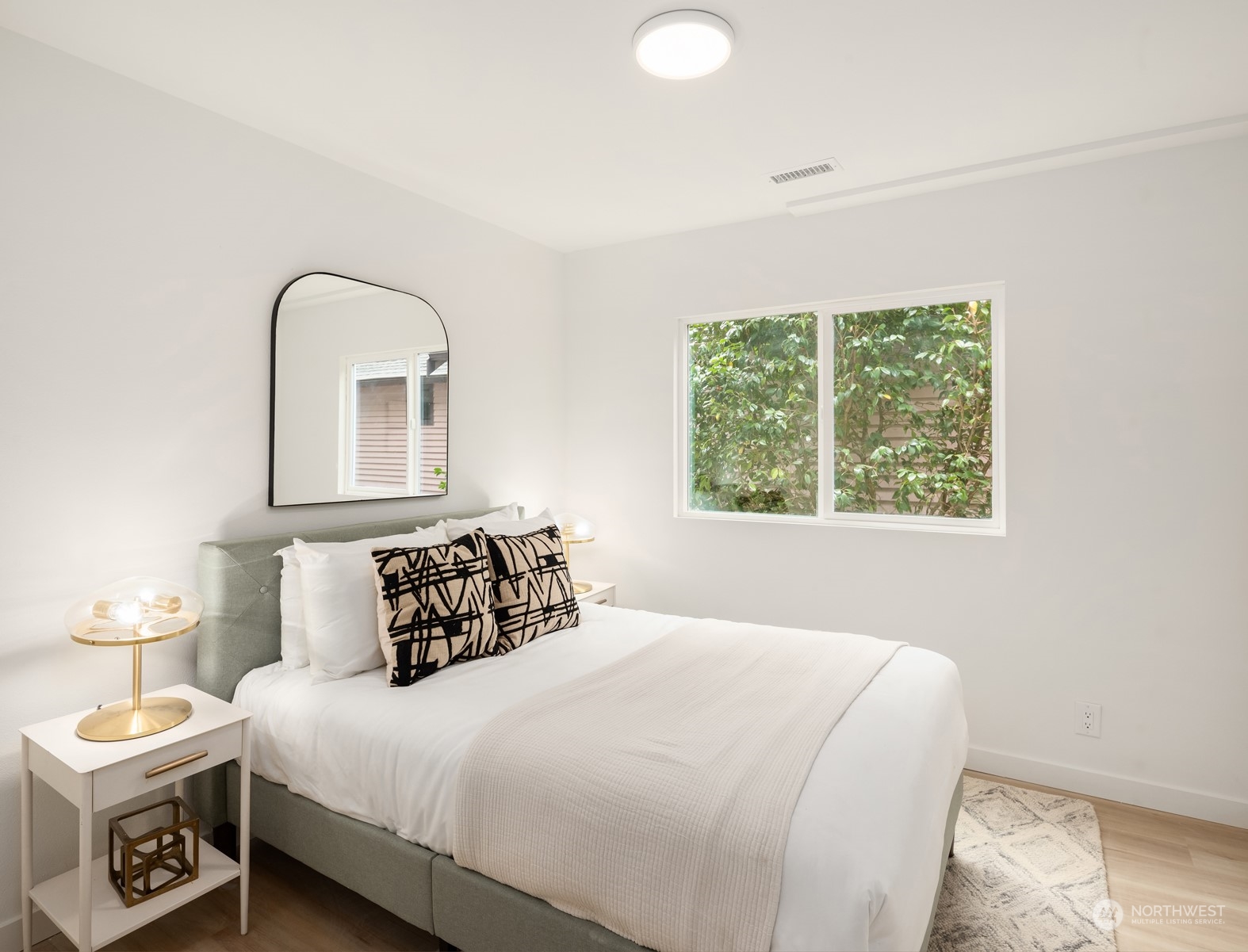 2375 Northeast 90th Street Seattle, WA 98115 - Photo 22 of 27 a bedroom with a bed and a window
