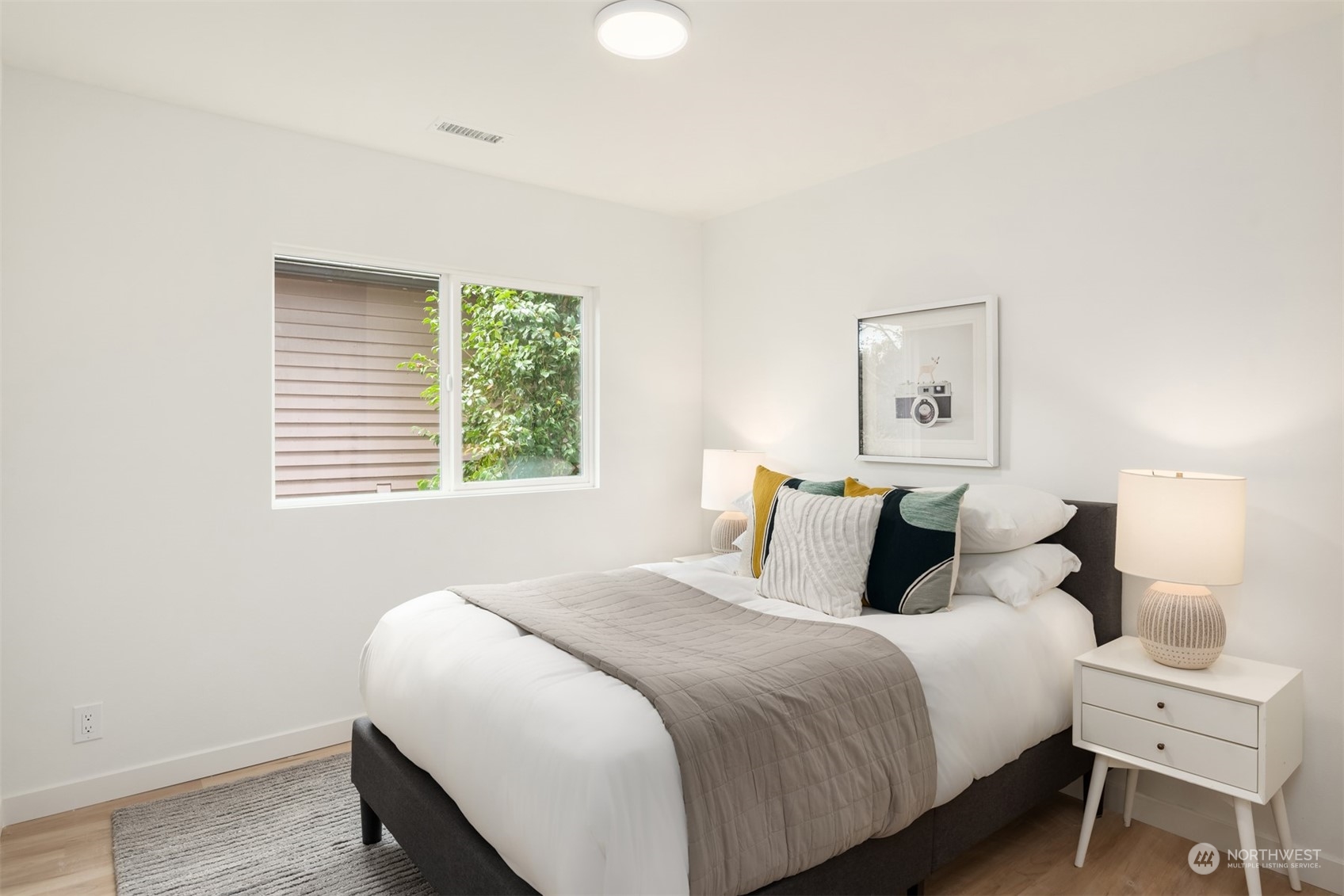 2375 Northeast 90th Street Seattle, WA 98115 - Photo 23 of 27 a bedroom with a bed and a window