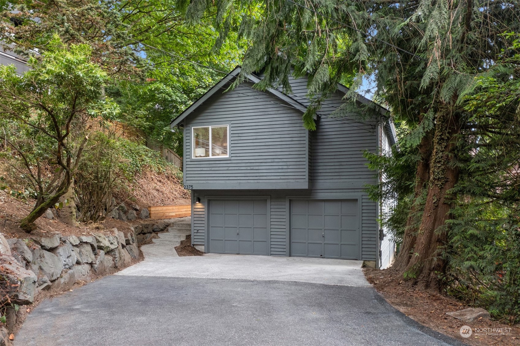2375 Northeast 90th Street Seattle, WA 98115 - Photo 27 of 27 a front view of a house with a garage