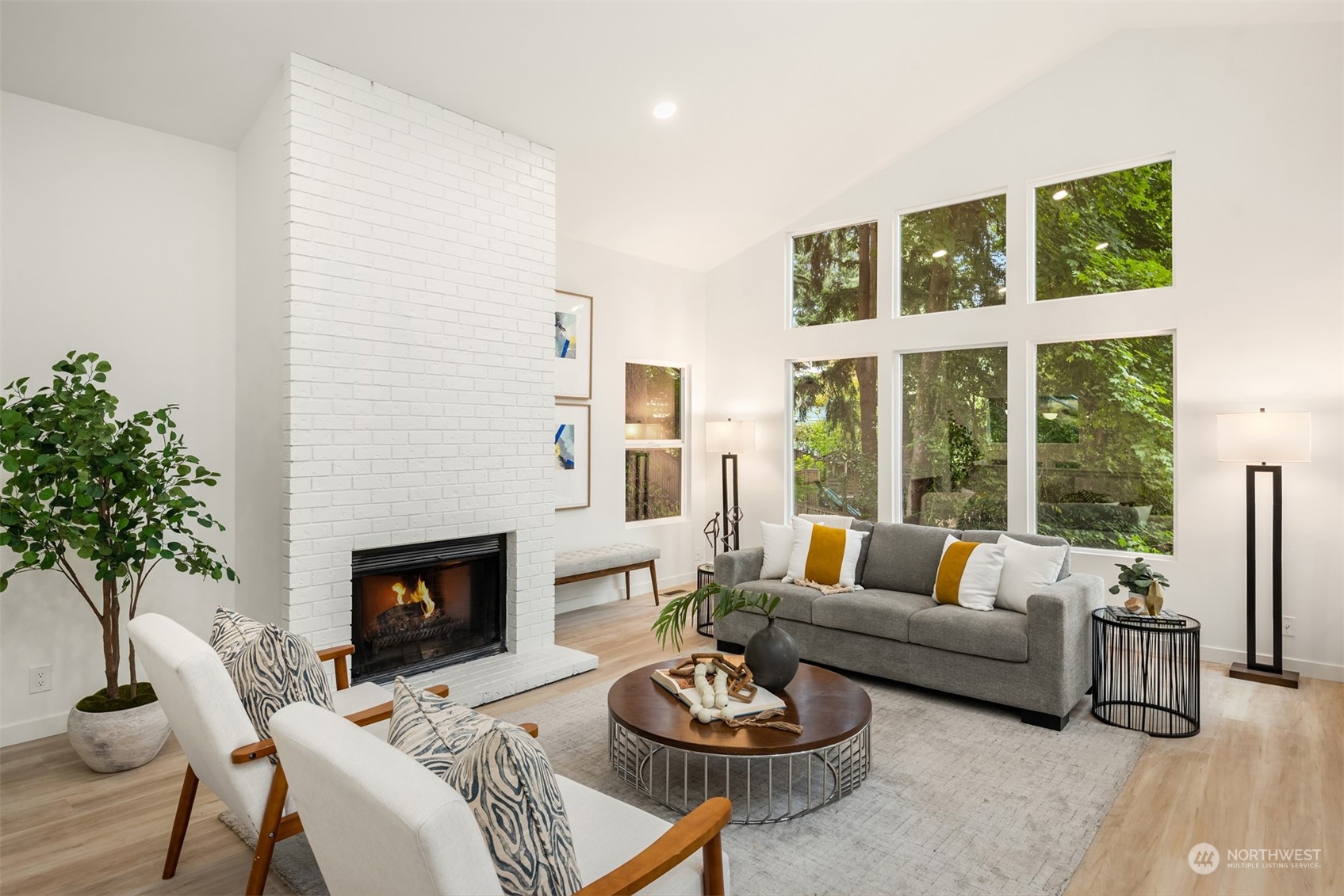 2375 Northeast 90th Street Seattle, WA 98115 - Photo 4 of 27 a living room with furniture a fireplace and a large window