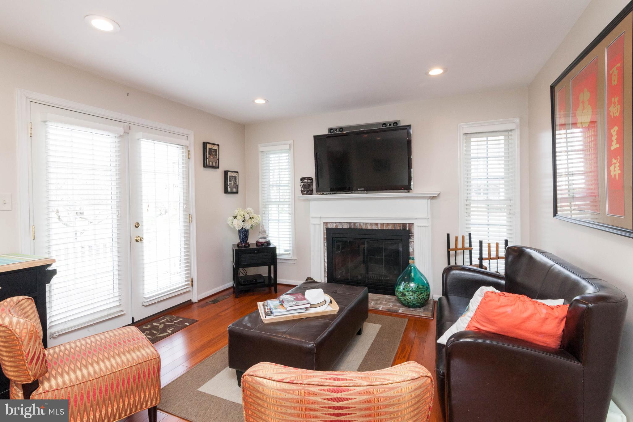 6586 Forsythia Street Springfield, VA 22150 - Photo 14 of 30 Family Room leads to deck