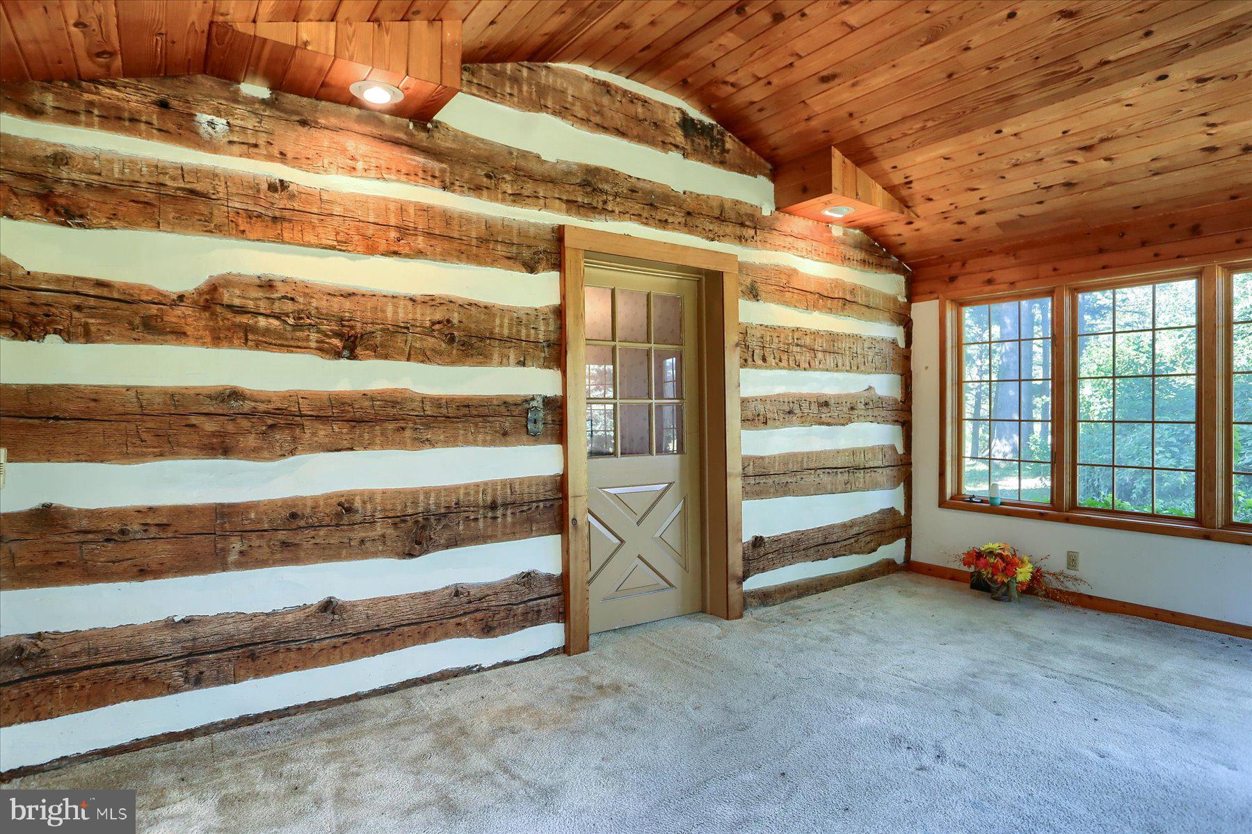 830 Stauffers Church Road Palmyra, PA 17078 - Photo 28 of 53 Log wall in rear of Sunroom