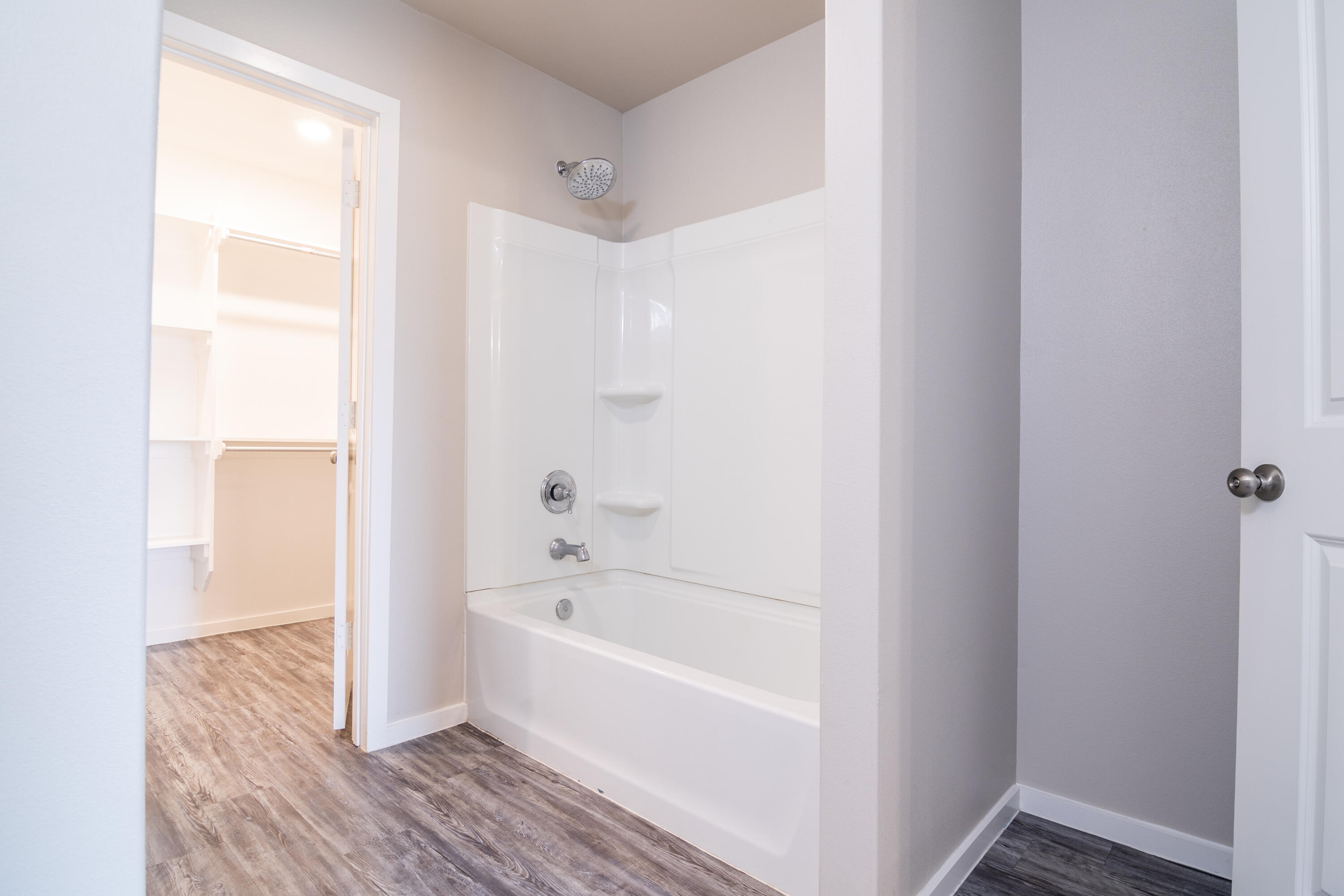 2118 Langford Avenue, Unit B Lubbock, TX 79407 - Photo 13 of 19 a bathroom with a bathtub and shower