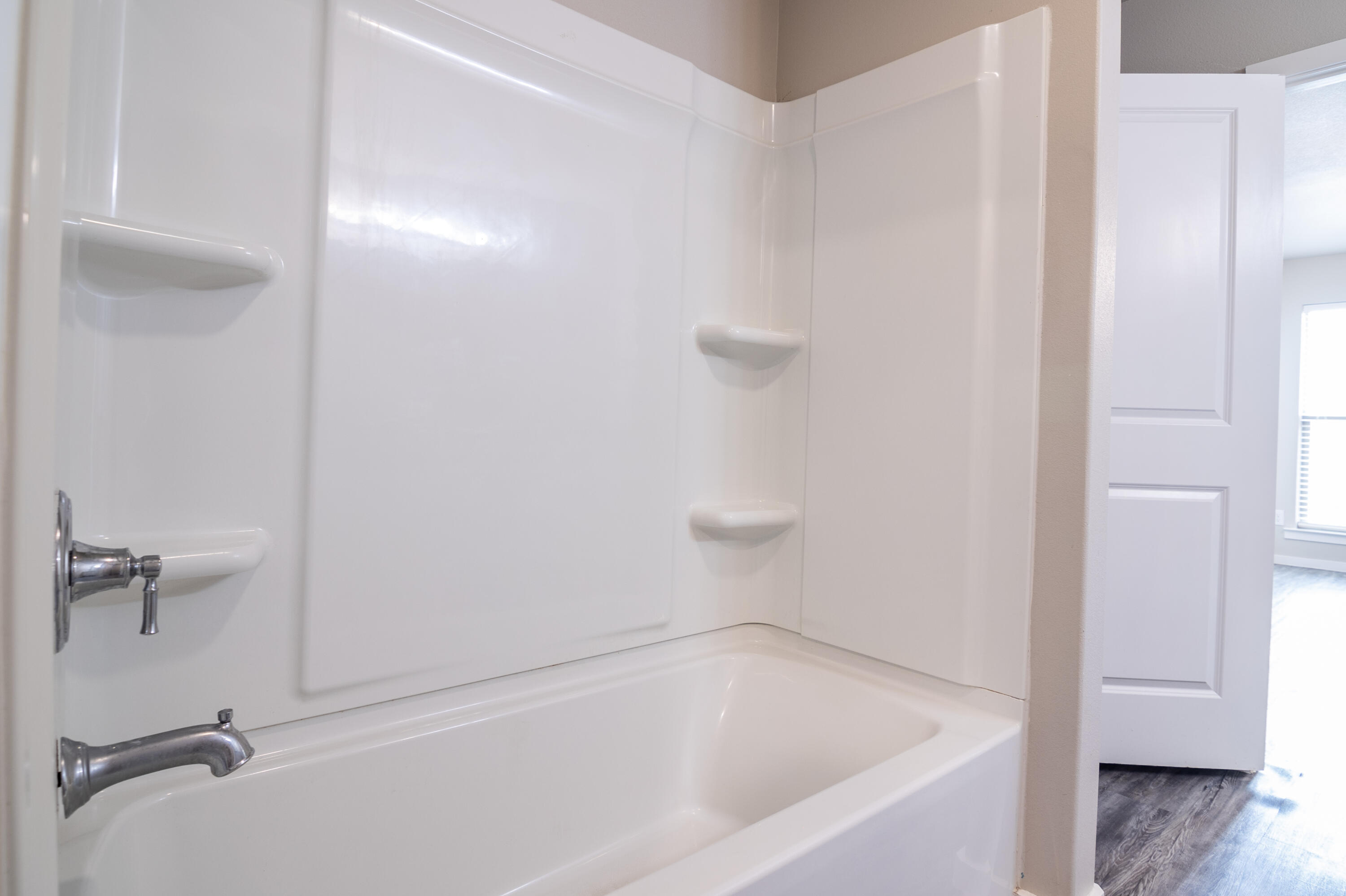 2118 Langford Avenue, Unit B Lubbock, TX 79407 - Photo 14 of 19 a bathroom with a bathtub