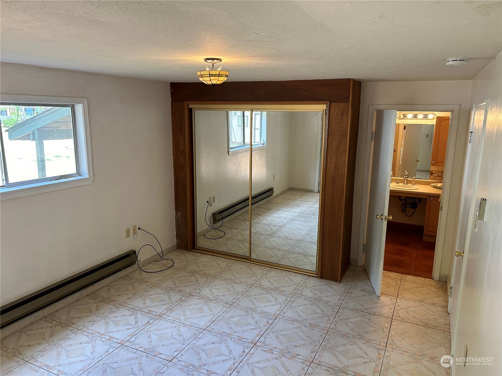 41 Cove Way Brinnon, WA 98320 - Photo 11 of 39 an empty room with windows and closet