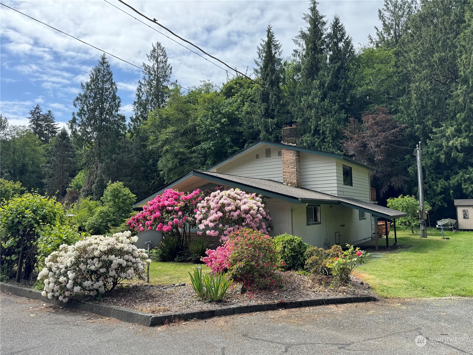 41 Cove Way Brinnon, WA 98320 - Photo 2 of 39 a front view of house with a yard and outdoor seating
