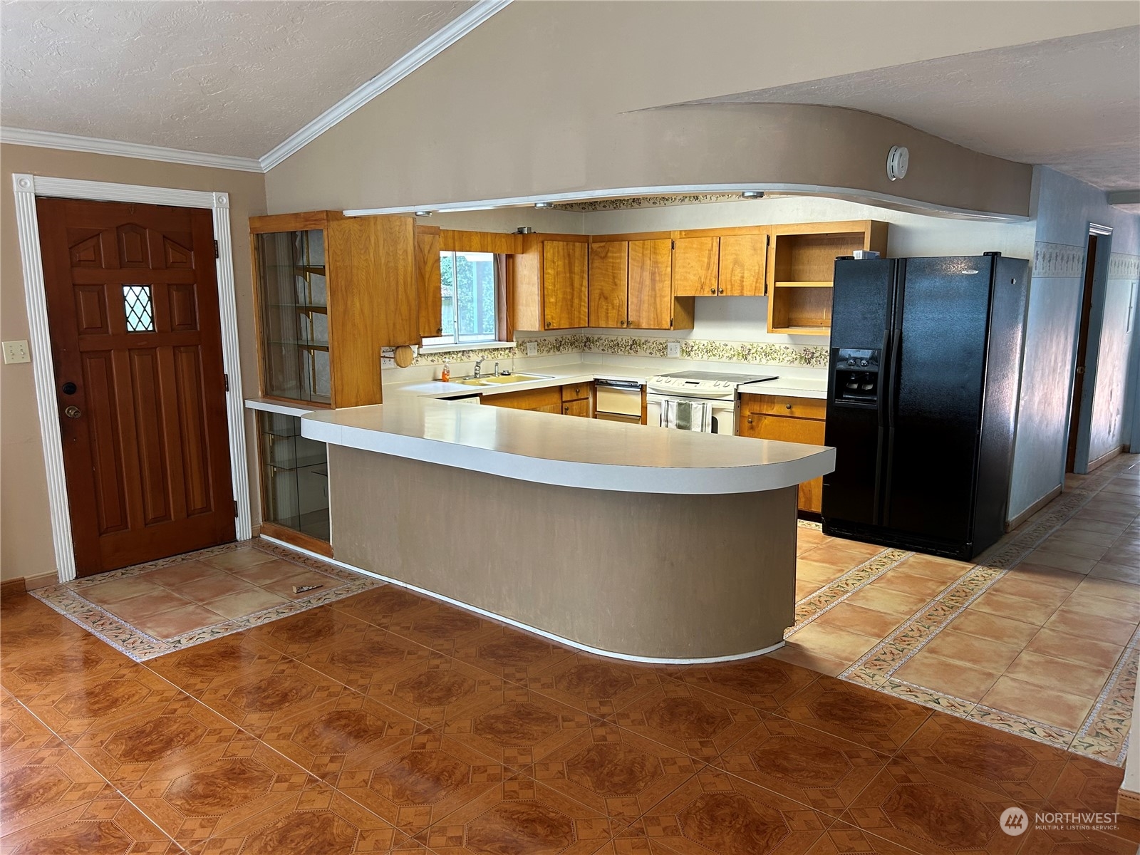 41 Cove Way Brinnon, WA 98320 - Photo 8 of 39 a large kitchen with kitchen island a large counter top stainless steel appliances and cabinets