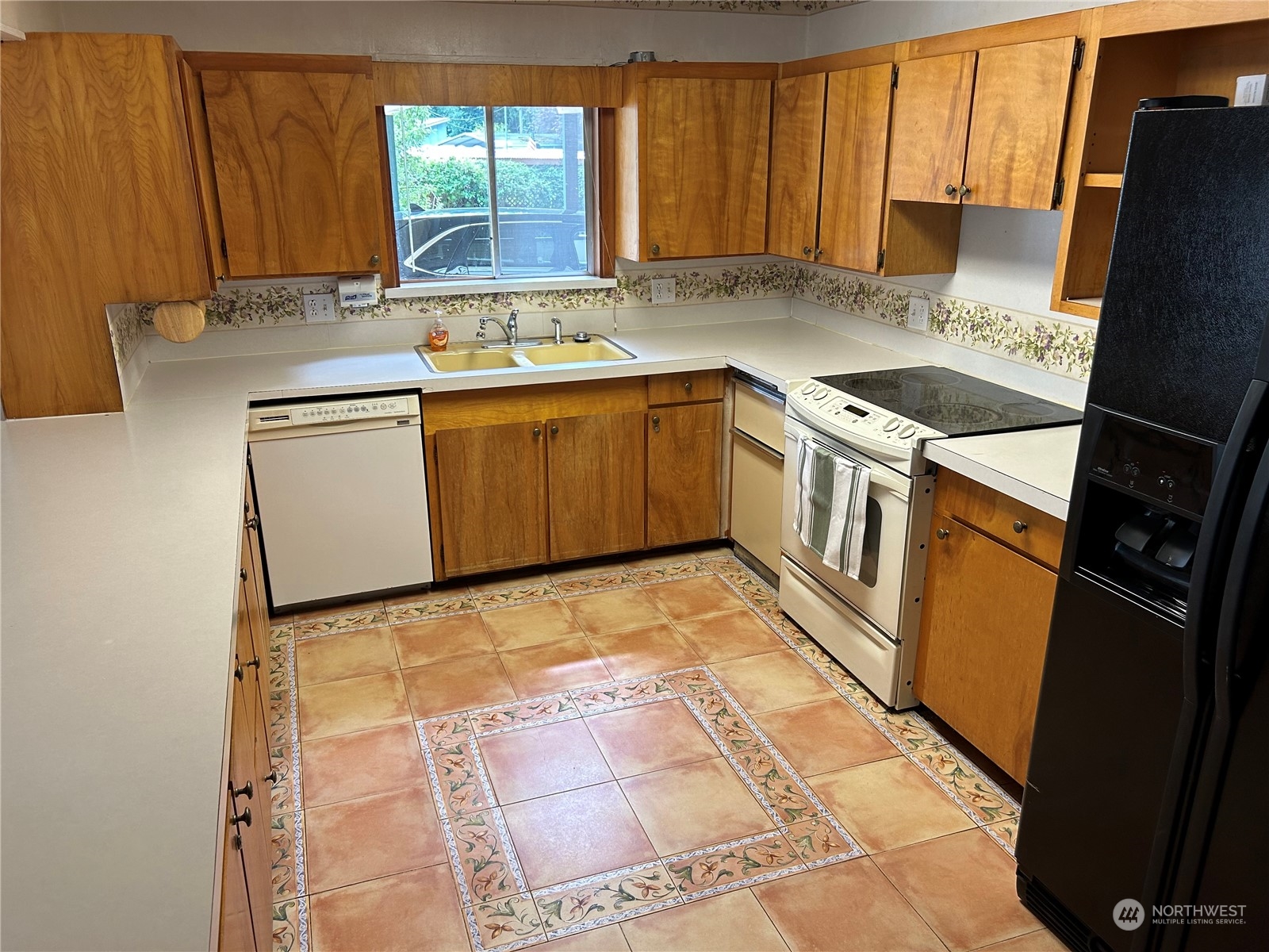 41 Cove Way Brinnon, WA 98320 - Photo 9 of 39 a kitchen with a sink stove and cabinets