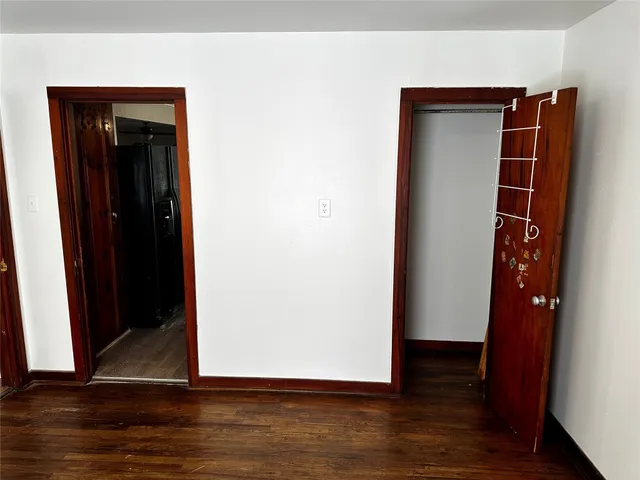 a view of walk in closet with wooden floor