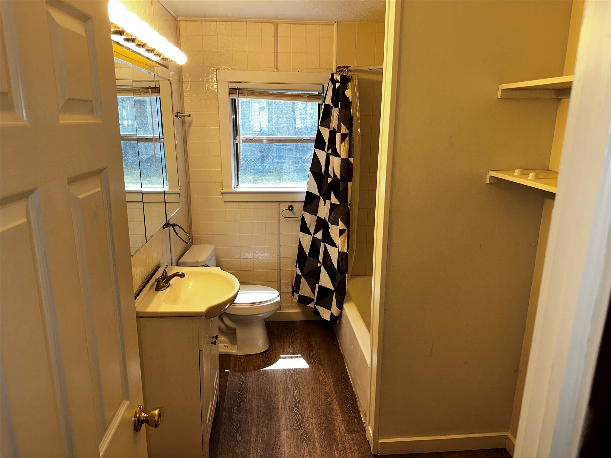 3307 Triplett Street Bacliff, TX 77518 - Photo 16 of 29 a bathroom with a sink and mirror
