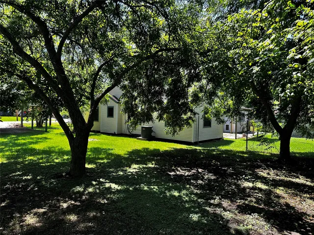 a house with a tree in front of it