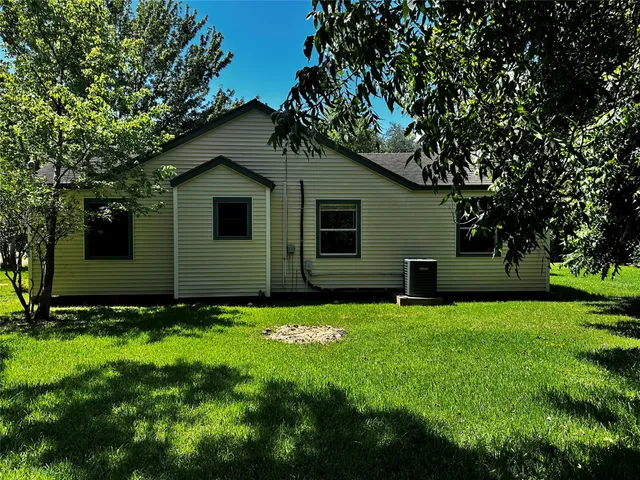 a view of swimming pool with deck and garden