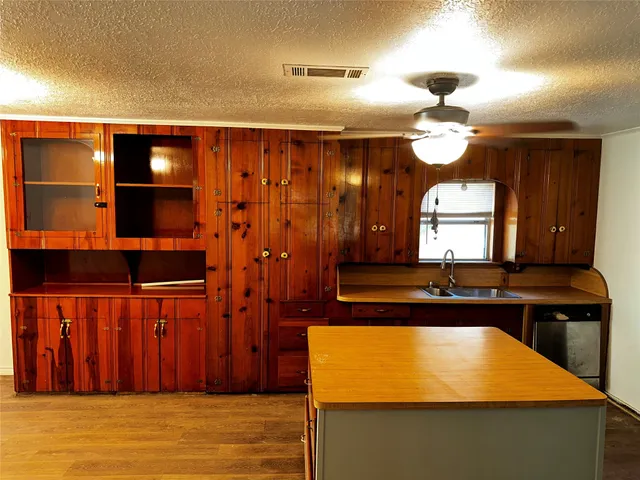 a bathroom with a sink and a large mirror