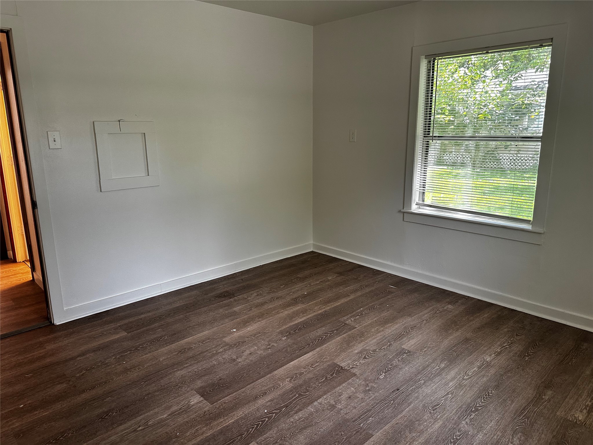 3307 Triplett Street Bacliff, TX 77518 - Photo 8 of 29 an empty room with wooden floor and windows