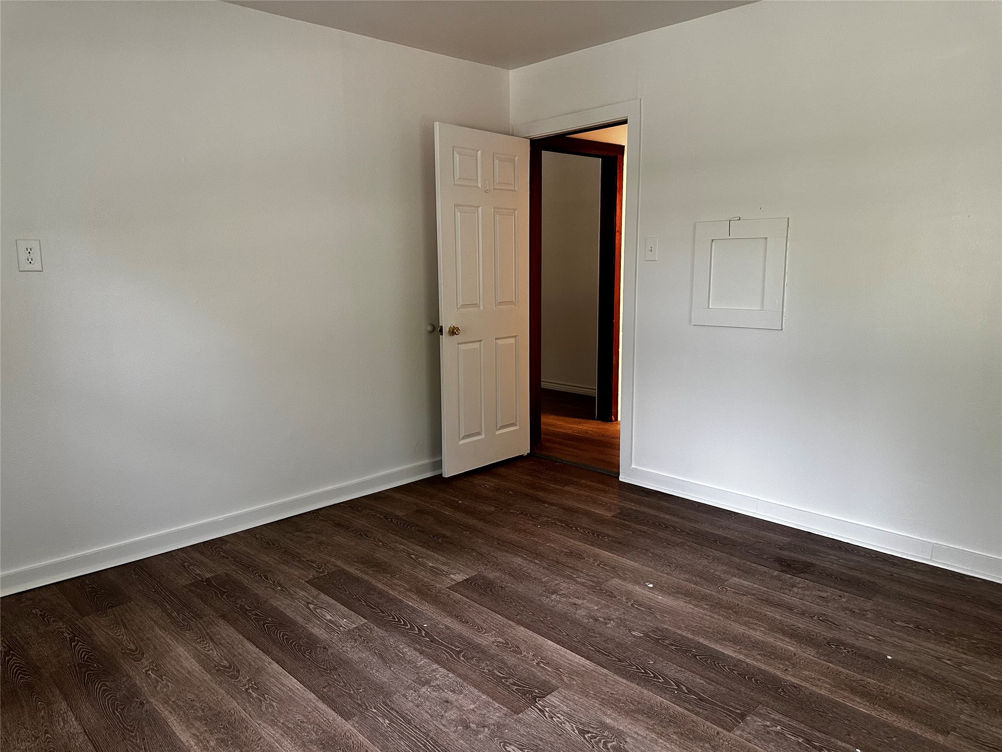 3307 Triplett Street Bacliff, TX 77518 - Photo 9 of 29 a view of an empty room with wooden floor and closet
