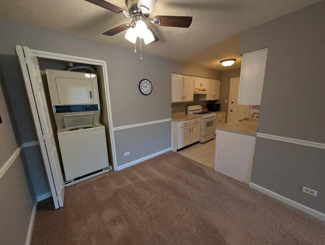 a view of a kitchen with a sink dishwasher and a refrigerator