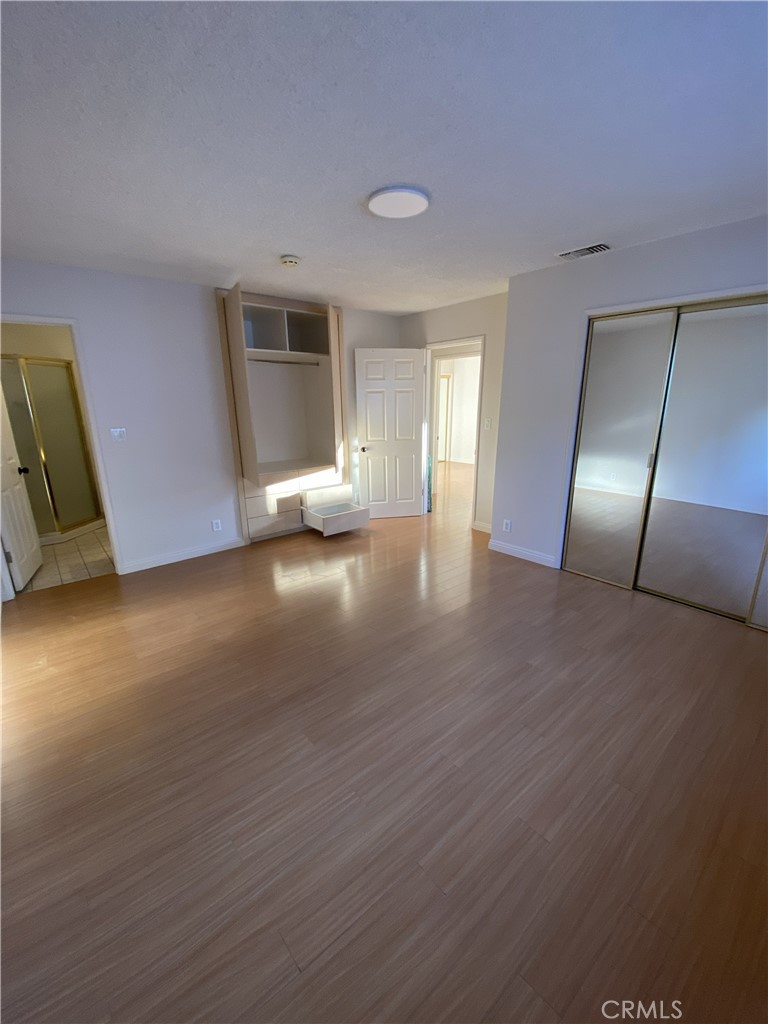10535 Samoa Avenue Tujunga, CA 91042 - Photo 13 of 25 a view of empty room with wooden floor