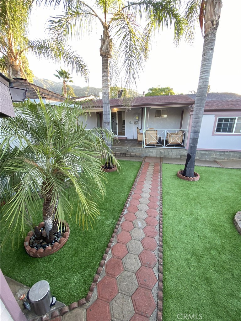 10535 Samoa Avenue Tujunga, CA 91042 - Photo 23 of 25 a front view of a house with garden