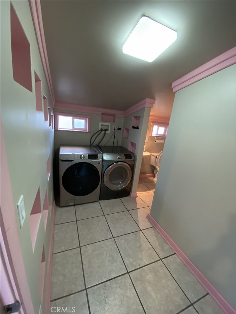 10535 Samoa Avenue Tujunga, CA 91042 - Photo 5 of 25 a kitchen with a sink a washer and dryer