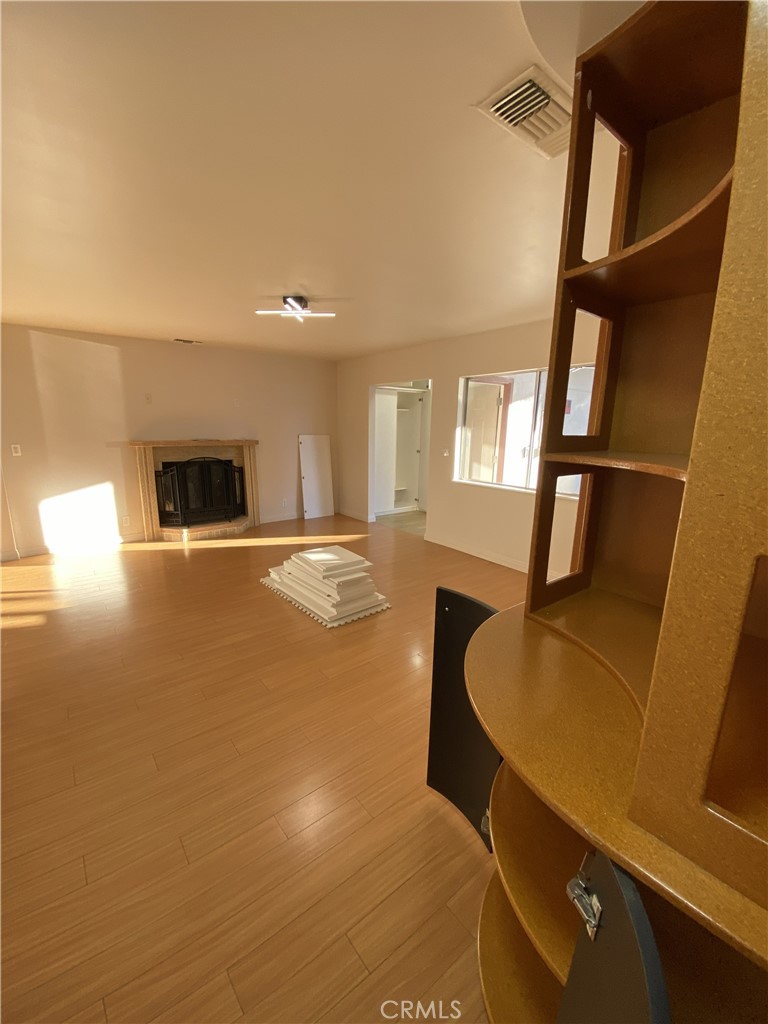 10535 Samoa Avenue Tujunga, CA 91042 - Photo 10 of 25 a living room with furniture and a fireplace