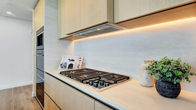 a bedroom with a large window and a balcony