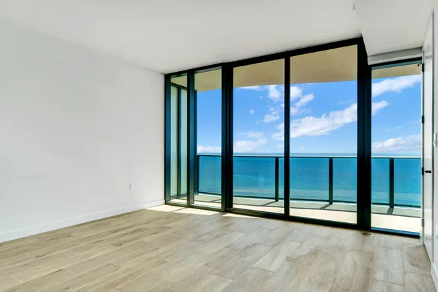 en empty room with large windows