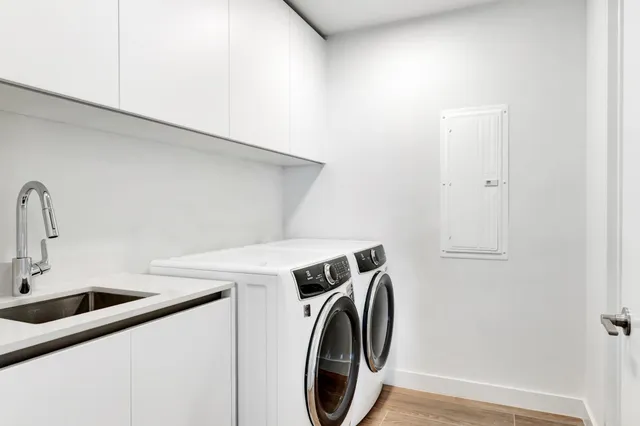 front view of a house with swimming pool and sitting area