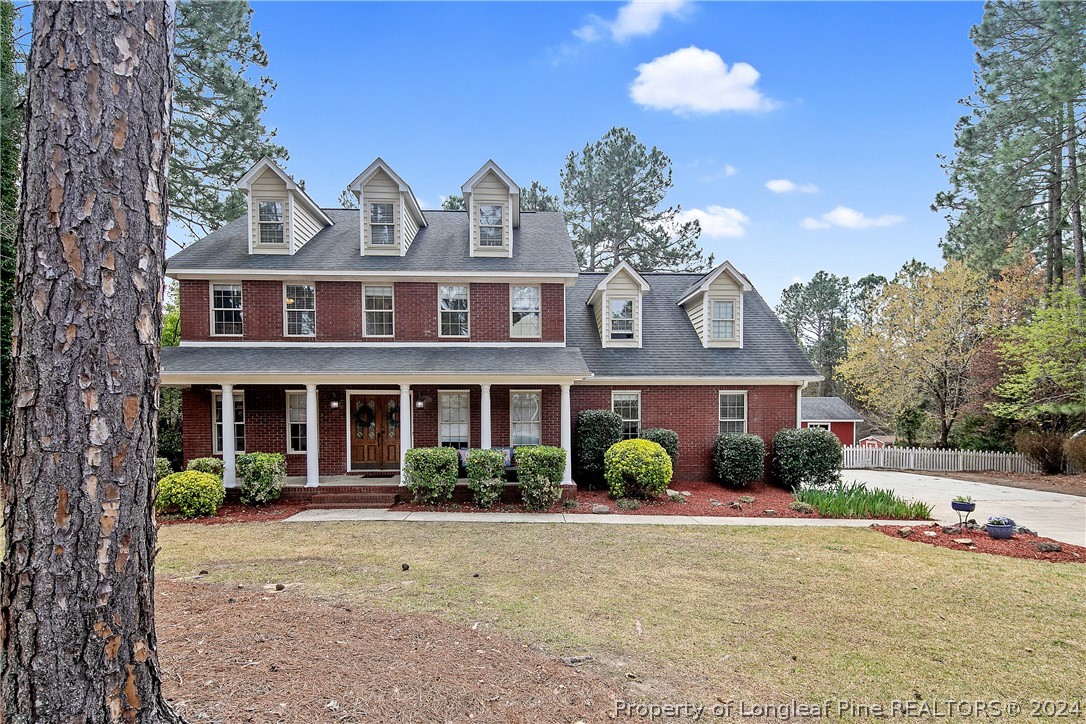 7833 Shuttle Road Fayetteville, NC 28311 - Photo 1 of 46 a front view of a house with garden