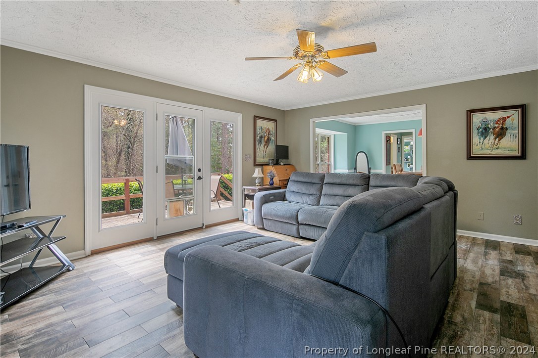 7833 Shuttle Road Fayetteville, NC 28311 - Photo 11 of 46 a living room with furniture and a large window