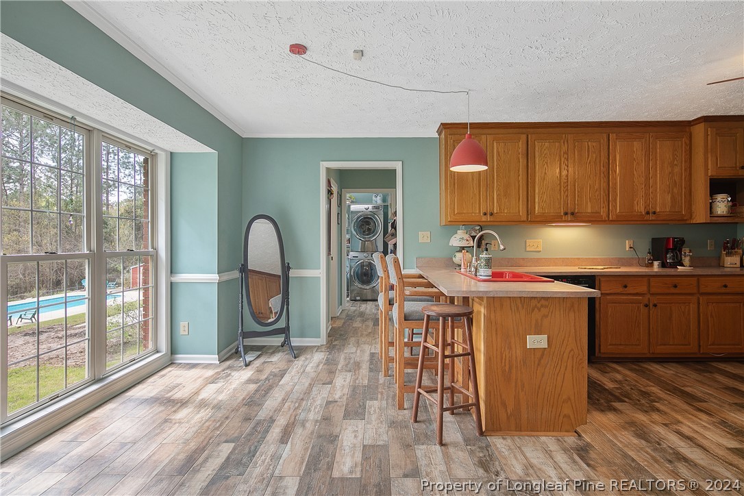 7833 Shuttle Road Fayetteville, NC 28311 - Photo 14 of 46 a kitchen with a sink cabinets and window