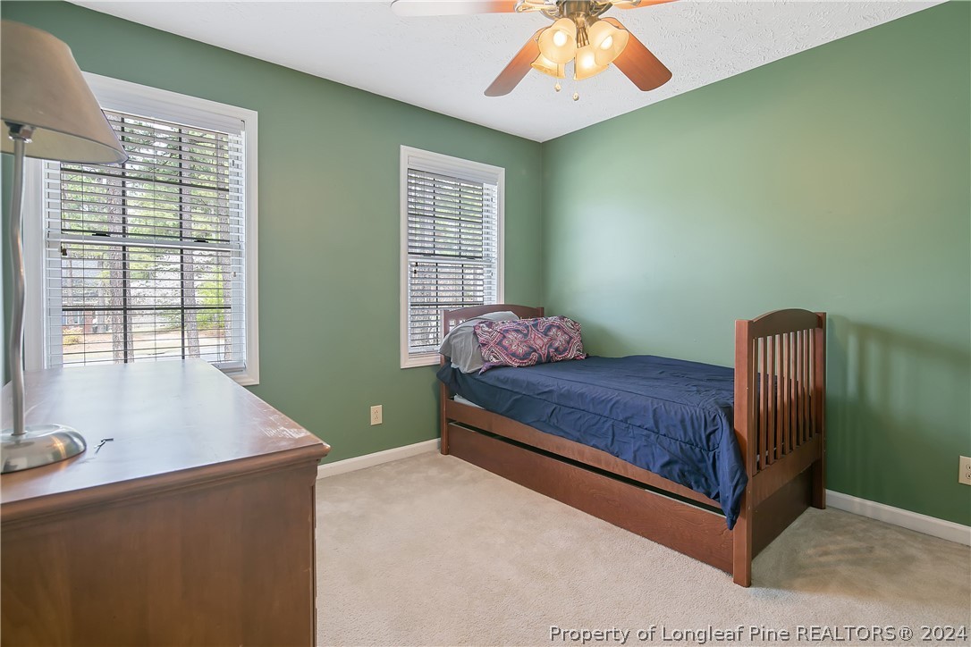 7833 Shuttle Road Fayetteville, NC 28311 - Photo 30 of 46 a bedroom with a bed and a window