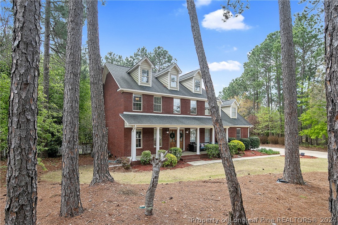 7833 Shuttle Road Fayetteville, NC 28311 - Photo 3 of 46 a front view of a house with a porch