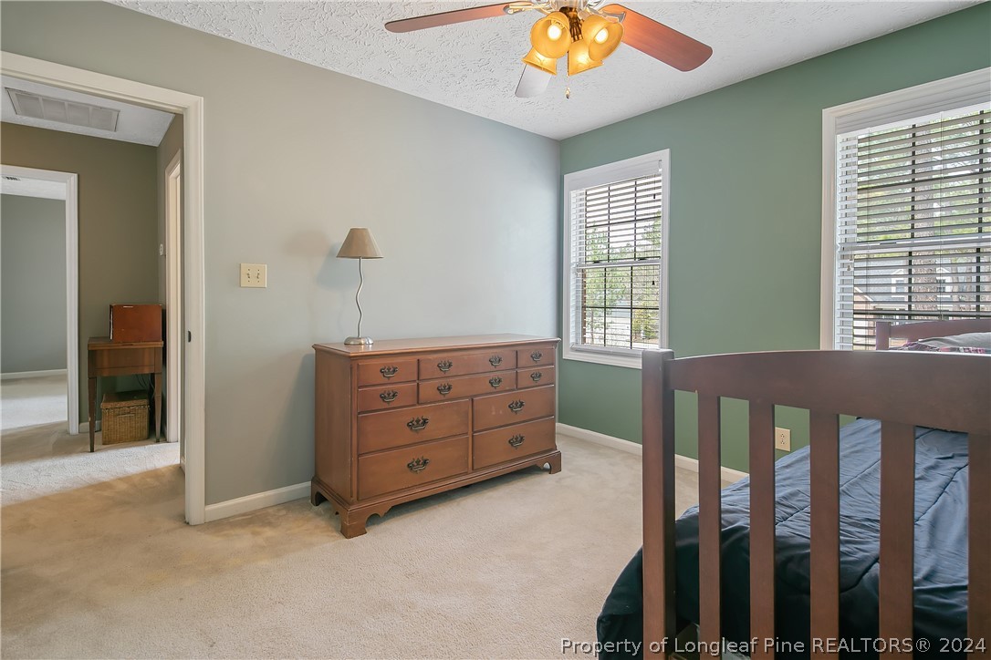 7833 Shuttle Road Fayetteville, NC 28311 - Photo 32 of 46 a view of a bedroom with windows