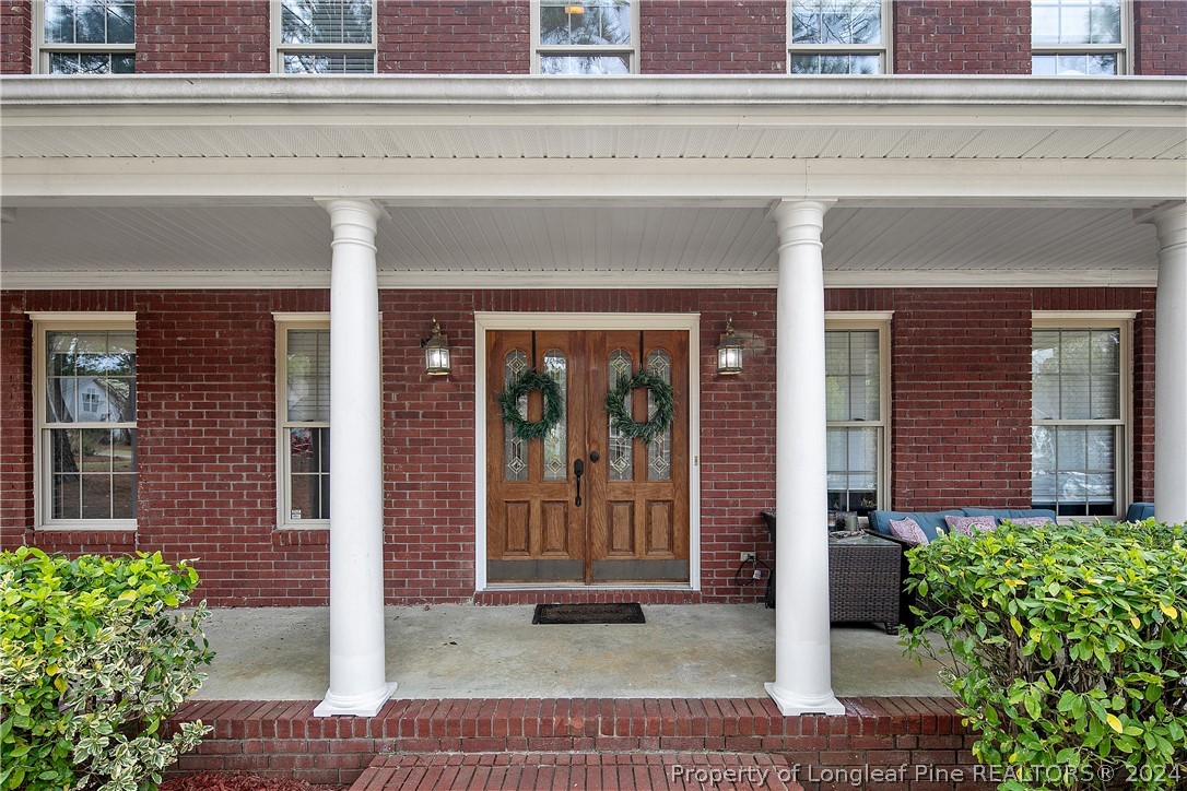 7833 Shuttle Road Fayetteville, NC 28311 - Photo 4 of 46 front view of the house and a window