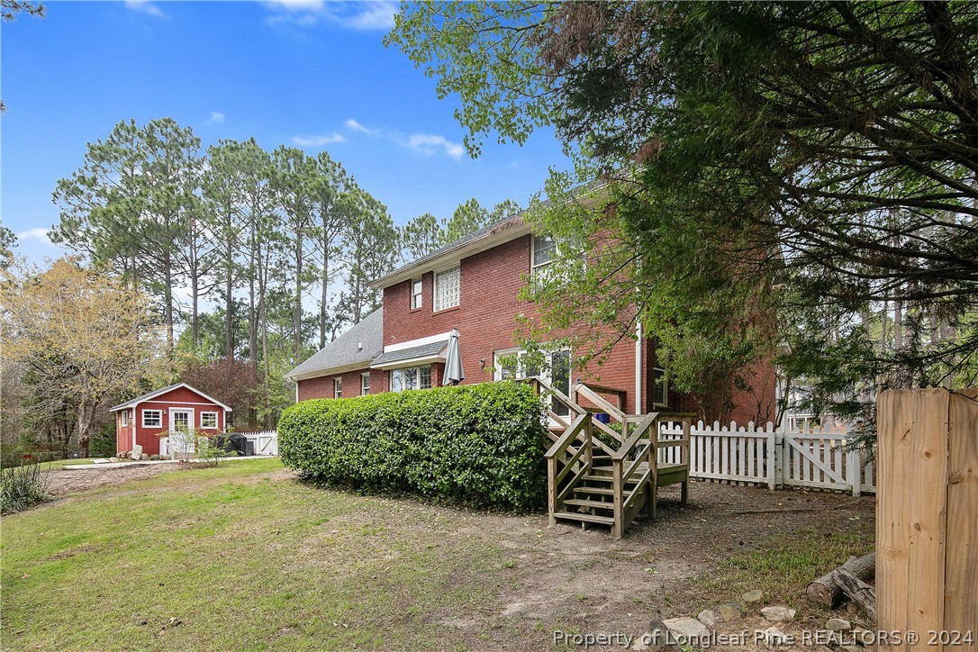 7833 Shuttle Road Fayetteville, NC 28311 - Photo 41 of 46 a front view of a house with garden